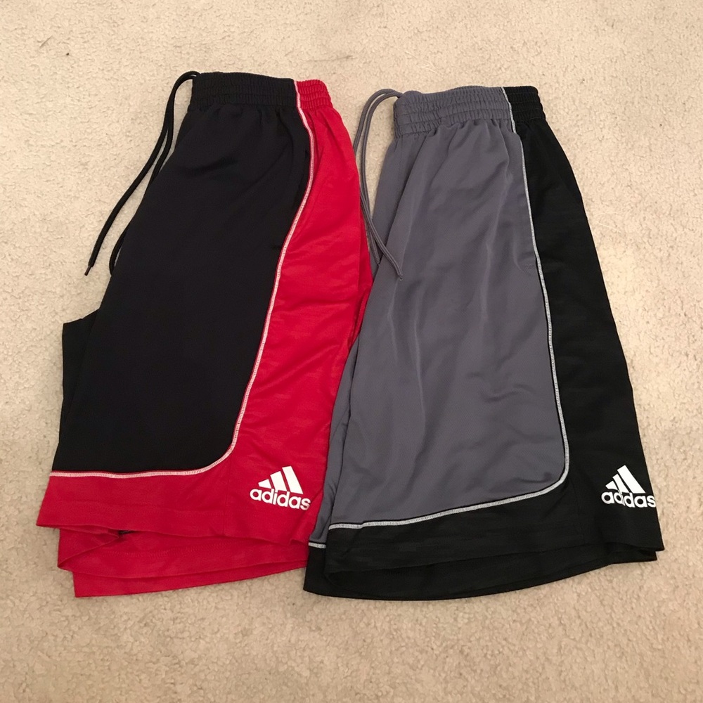 two pairs of Adidas shorts